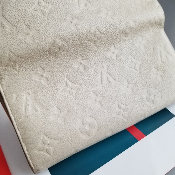 LOUIS VUITTON Portefeuille Empreinte Neige Mono - Picture 9 of 16